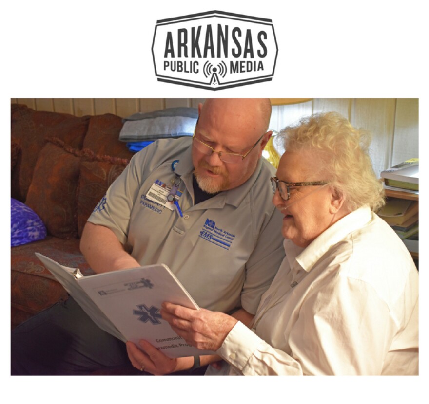 Jason Moshier, North Arkansas Regional Medical Center Community Paramedics section chief, visits with Julie Younes, an 87-year old  Community Paramedic program patient.