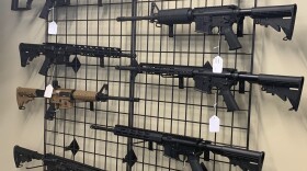 AR-15's on a wall rack.