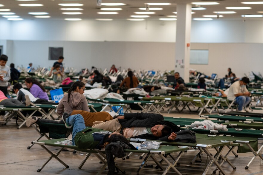 Asylum seekers lay down on cots while in Casa Alitas, a temporary shelter.