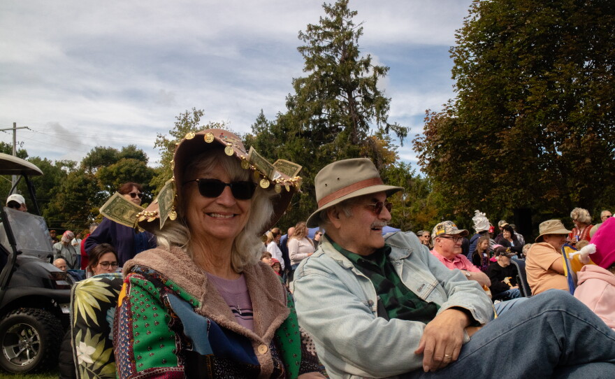 Gail McKenzie, left and Mikey McKenzie, right, wait patiently for the formal mystery safe extravaganza to begin.