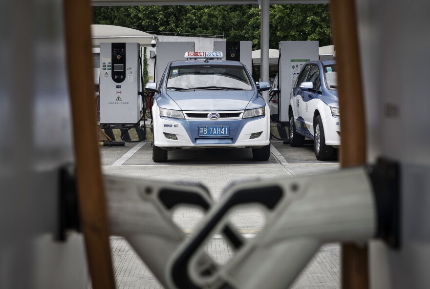 A BYD electric taxi is charged at the company's charging station in Shenzhen, China.