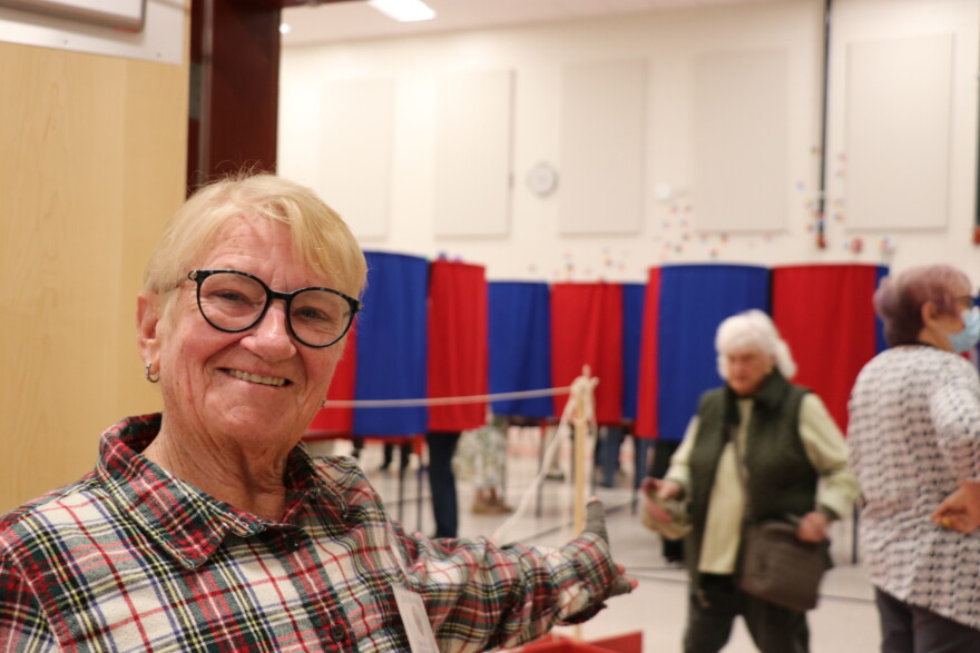 Sharon Nichols stands at the entrance to a polling location