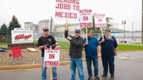 Kellogg workers demonstrate in front of one of the company's cereal plants in Battle Creek, Mich., on Oct. 7