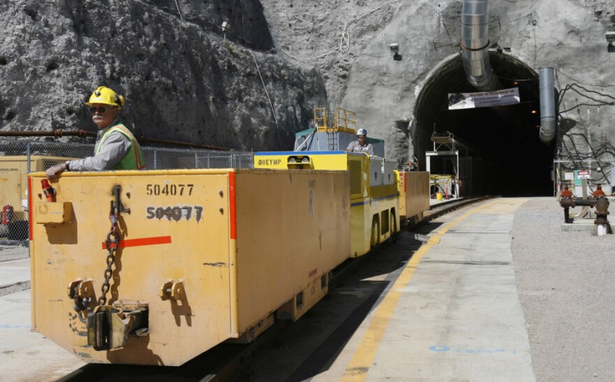 An underground train emerges from the entrance to the planned Yucca Mountain Nuclear Waste Repository in 2006. The government has since abandoned the site as a location for the long-term storage of nuclear waste.