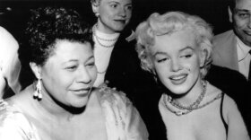 Actress Marilyn Monroe is pictured with singer Ella Fitzgerald on November 18, 1954, at the Tiffany nightclub in Hollywood where Fitzgerald was performing.