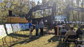 (Left-to-right) Tallahassee Housing Consortium's Greg Lane and Karen Miller, Leon County Commission Chair Christian Caban and (at rostrum) Tallahassee Mayor Pro-Tem Curtis Richardson.