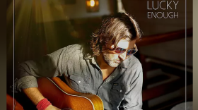 Album cover with artist playing guitar