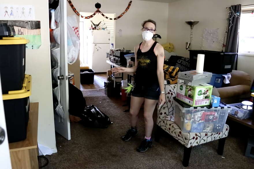 Pinewood Drive resident Maria Smith surveys the flood damage to her home. "The floor is starting to buckle. The floor is still wet," Smith said. "That's why the mask is a big deal - mold is a problem."