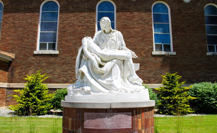 The Pieta statue is a part of the yard in Holy Family Catholic Church.