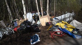 A large homeless camp sits immediately adjacent to the Campbell Creek Greenbelt Trail. Homeless camps are a regular sight along portions of Anchorage's trails this spring. Photographed May 7, 2024. (Anne Raup / ADN)