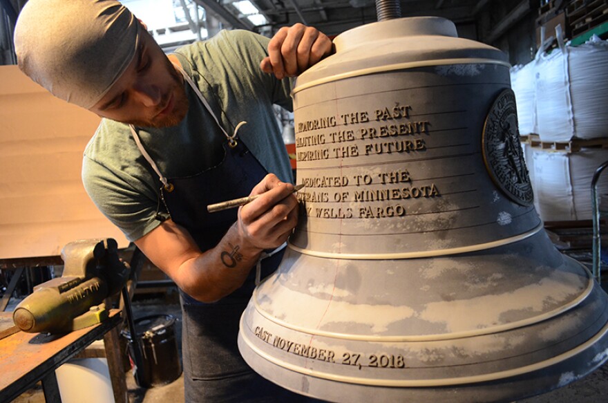 A Verdin employee works on the mold for the Spirit of Minnesota Tribute Bell cast Tuesday in Cincinnati.