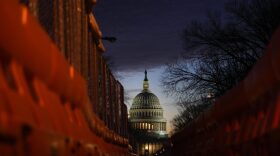A view of the U.S. Capitol down East Capitol Street at sunset in Washington, DC.