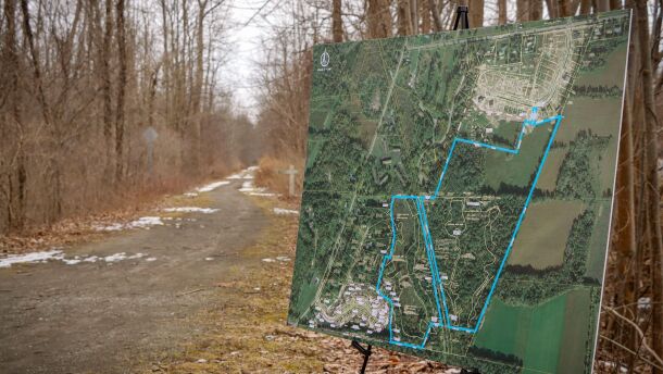 Monroe County and Town of Henrietta officials gathered on Friday, 3/3/23, at the site of what is expected to become the county's newest park, with a map display boundaries of how the 70-acre parcel will be used.