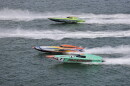 Two boats race each other on the water 