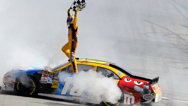 FILE - Kyle Busch celebrates his win in the NASCAR Sprint Cup Series' Autism Speaks 400 auto race, Sunday, May 16, 2010, in Dover, Del. (AP Photo/Nick Wass, File)