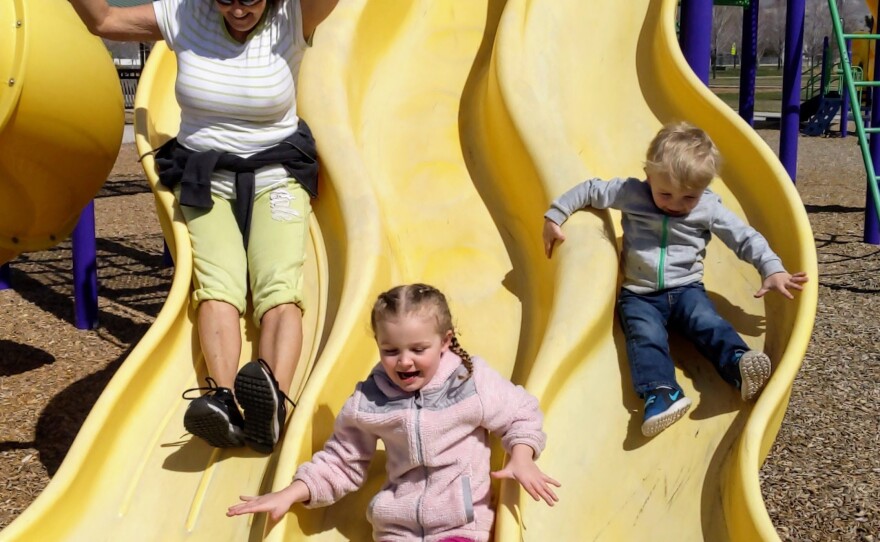 Tracy Larsen plays with her grandkids, Braylin (middle) and Dreyson (right).