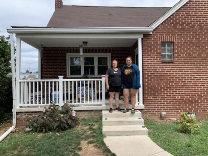 Deb and Samantha Sharp stand outside their home in Middletown on Aug. 10, 2022.