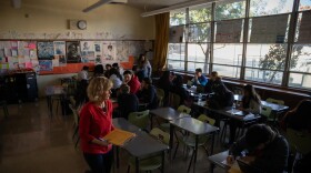 San Lorenzo High School teacher Judy Smith teaches her third period government class in San Lorenzo on Dec. 3, 2024, as they develop civic action infographics on topics ranging from gun violence to vaping. Smith’s students will submit their final projects to the KQED Youth Media Challenge which will publish the infographics online to share how students see themselves, their world and their future.
