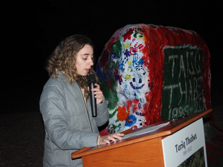 Saba Saed, President of the MSU Arab Cultural Society; one of the groups who organized the vigil for Tariq Thabet, a Humphrey fellow at MSU who was killed along with 15 members of his family in an Israeli bombing of his apartment, speaks at the event