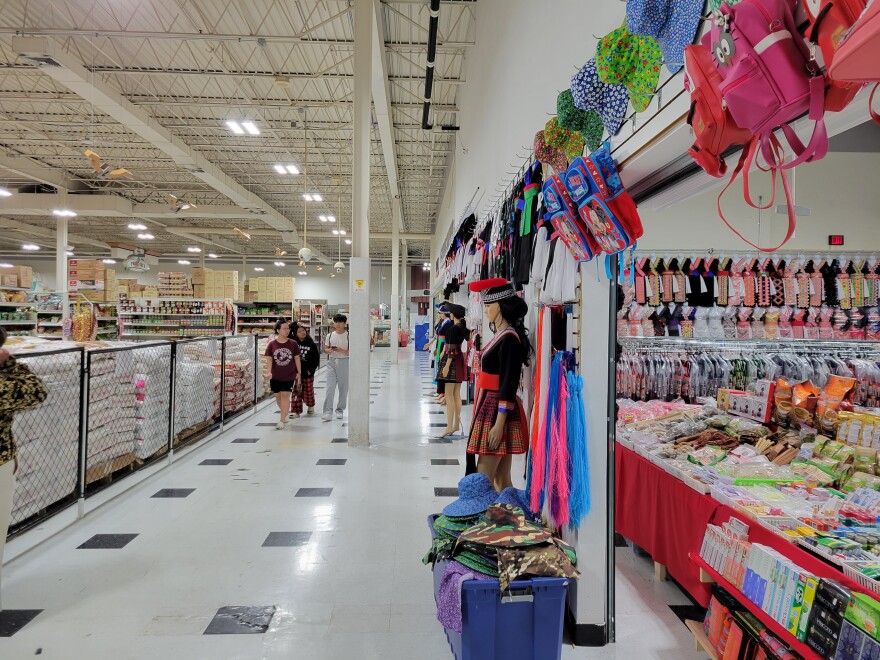 The grocery store at Hmong Town Market is connected to a dry goods market with clothes and toiletries on the way to a food court.