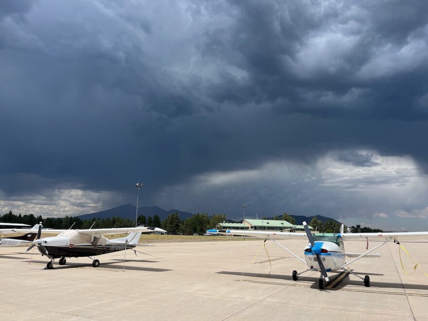 The first monsoon storm of the year moves in over the San Francisco Peaks on Mon, July 17, 2023 as seen from the tarmac at Pulliam Airport in Flagstaff.