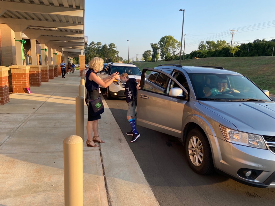  Principal Susan Redmond welcomes arrivals at the first day of school at the new Belmont Middle School on South Point Road.