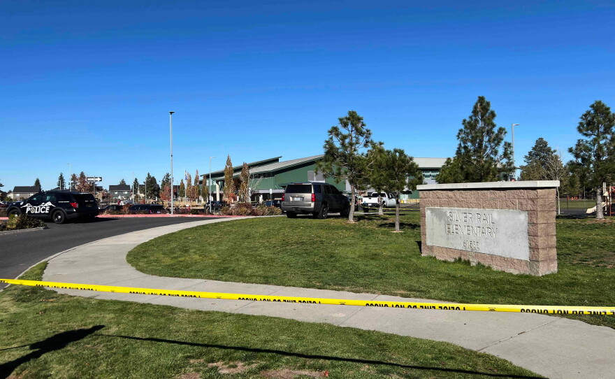 Police tape is placed outside Silver Rail Elementary school, where a shooting took place, on Thursday, Oct. 15, 2026 in Bend, Ore.