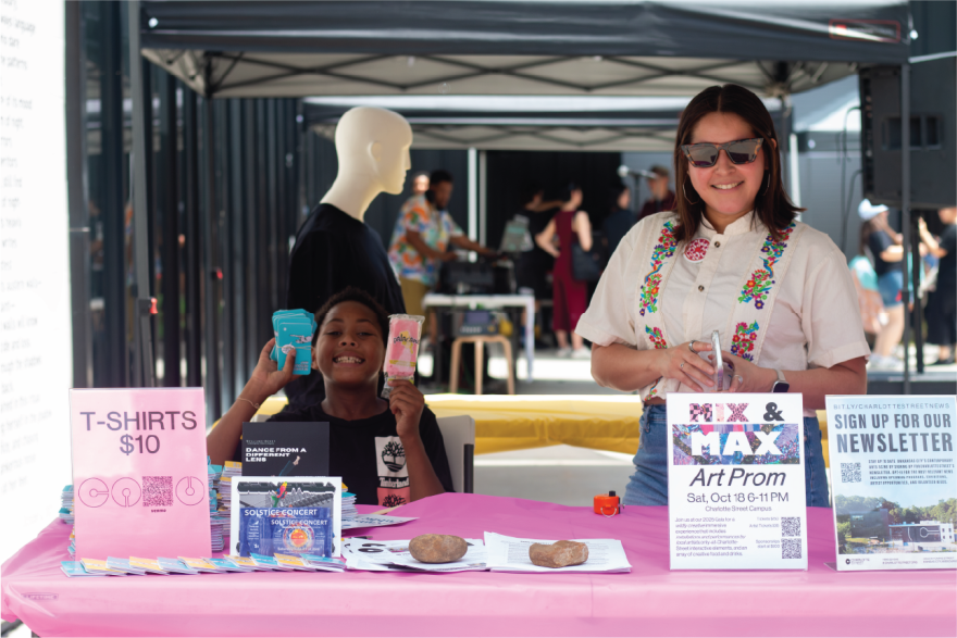 Charlotte Street foundation volunteers working at an information booth.