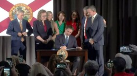  Flanked by state lawmakers and supporters at the Jaxport Cruise Terminal, Gov. Ron DeSantis signed legislation he said will protect Floridians from the environmental, social and corporate governance movement.