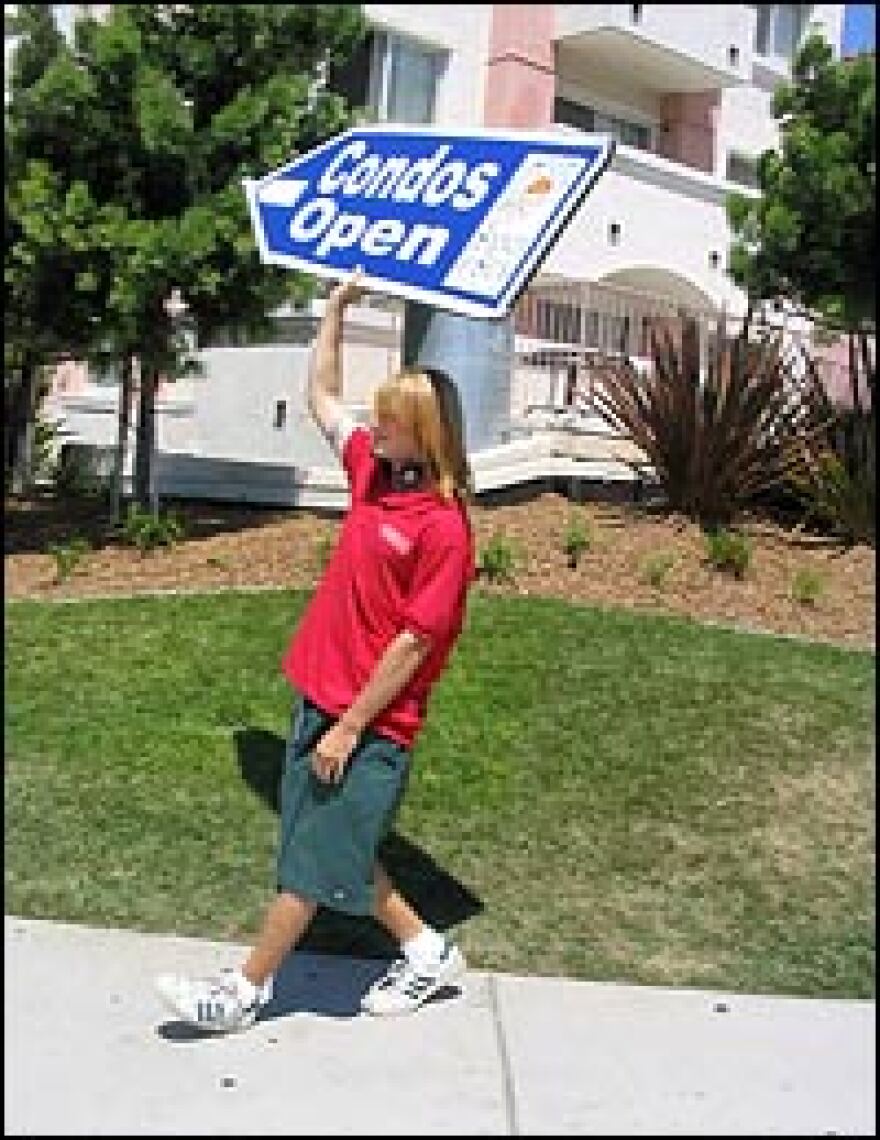 Street-corner advertiser Scott Webb has been pointing buyers in San Diego, Calif., towards condominiums for two years. Sign-twirling earns him $14.20 an hour.