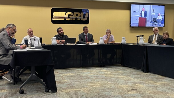 GRU Authority board members listen during the general public comment portion of the meeting on Wednesday, Oct 14, 2026. (Rachel Hunter/WUFT News)