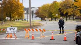 A police officer blocks access to the road to Sparetime Recreation on Oct. 26, 2023 in Lewiston, Maine. (Scott Eisen/Getty Images)