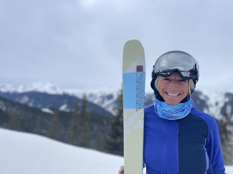 Kim Reichhelm smiles for a photo at the top of Aspen Mountain on Feb. 21, 2024. After decades of extreme skiing and international ski adventures, Reichhelm remains committed to a positive outlook about the sport: “My glass is more than half full,” she said.