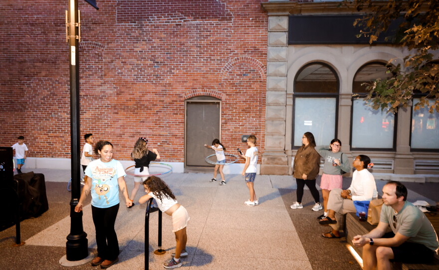 Children play and dance to Funayūrei's music on a warm summer evening at the Landing.