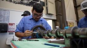 Students measure a part of a tractor engine in their agricultural mechanics class at Reedley College in Reedley on Sept. 11, 2024. Photo by Larry Valenzuela, CalMatters/CatchLight Local