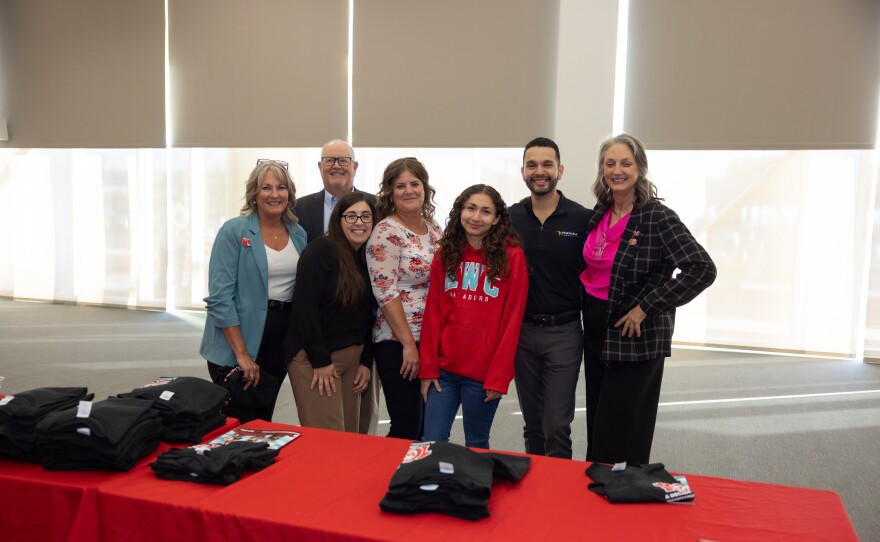 AWC Foundation staff and board members also attended the event, smiling for a photo alongside special Decade of Transformation t-shirts.
