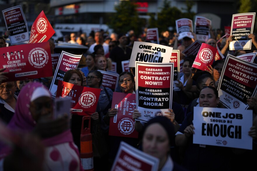 Members of the Culinary Workers Union rally along the Strip, Wednesday, Oct. 25, 2023, in Las Vegas.