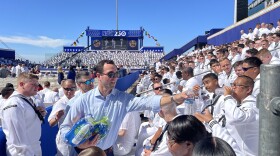 Organizers hand out water to sailors at the Titans of the Sea: A Salute to the Fleet event at Naval Station Norfolk.