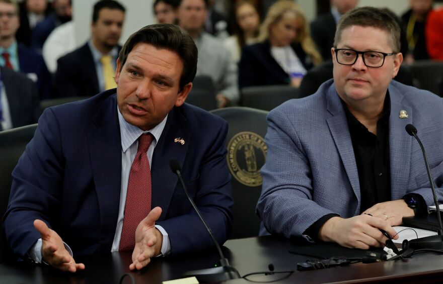 FRANKFORT, Feb. 18 – Florida Governor Ron DeSantis (left) and Rep. Jason Petrie, R-Elkton, present House Concurrent Resolution 45, a proposal related to the federal budget, during Wednesday’s House Committee on Elections, Constitutional Amendments