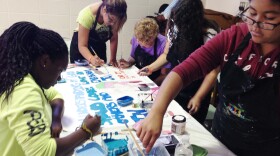 Students Making an ARTREACH Banner