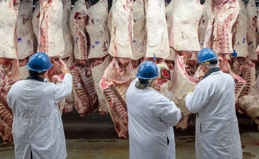 U.S. Department of Agriculture agricultural commodity graders inspecting beef. New Mexico ranchers must have their meat USDA-inspected before selling it commercially, but a bill moving through the Roundhouse would allow the New Mexico Livestock Board to stand up a state inspection program. 