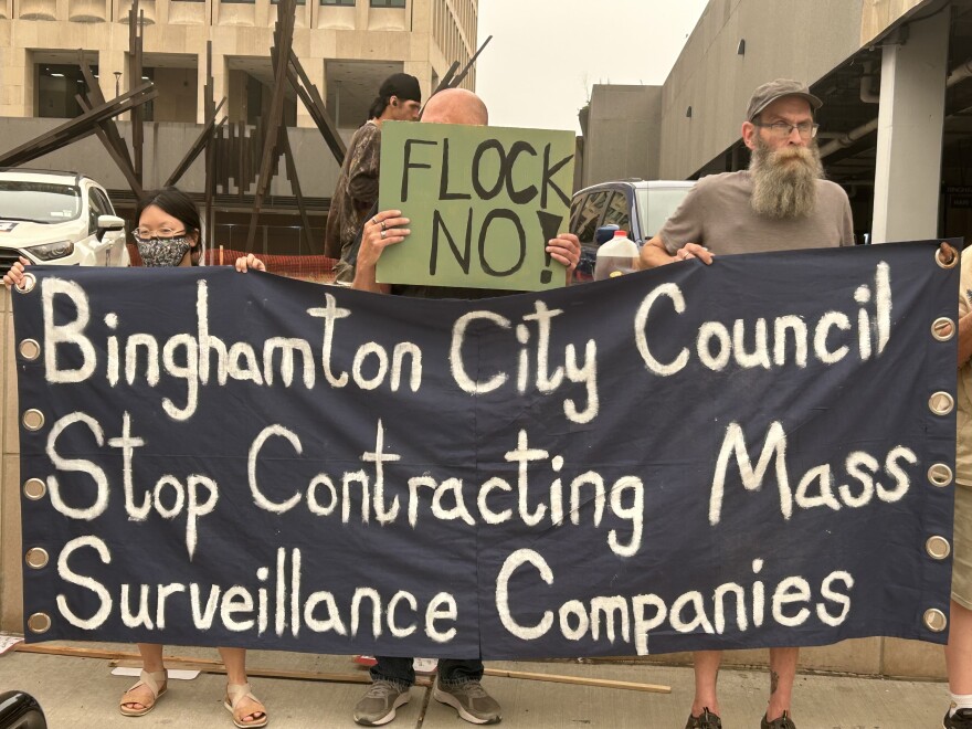 Protesters at a rally calling for the Binghamton City Council to not renew a contract with Flock Safety and end the use of all automatic license plate readers