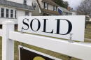 A sold sign hangs in front of a Brighton, New York house on Tuesday, February 21, 2023. (Ted Shaffrey/AP)