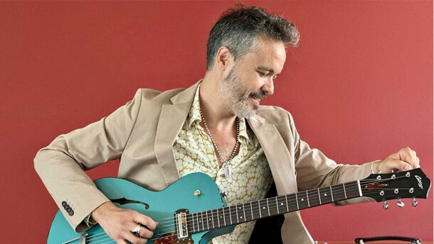 Twanguero with a blue guitar.