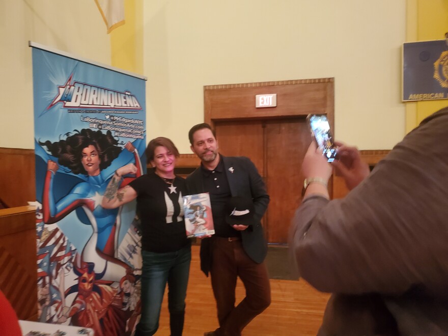  Marisol Rivera  poses for a photo with the author "La Borinqueña" Edgardo Miranda-Rodriguez in Holyoke, Massachusetts.