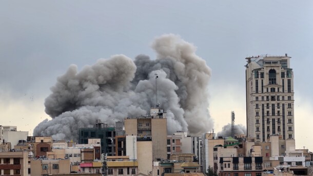 A plume of smoke rises after a strike in Tehran, Iran, Monday, March 2, 2026.