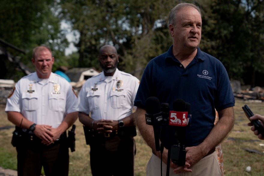 St. Louis County Executive Sam Page speaks to the press after a 3-alarm fire following the explosion of several homes on Monday, Aug. 25, 2025, in Black Jack — a part of St. Louis County.