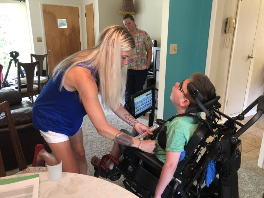 Decatur resident Brandy O'Connor at home with her son, Mark Bolen, 10. Mark has cerebral palsy and O'Connor said she has struggled to find a childcare facility willing and able to care for him.