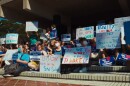 Students with signs protesting 