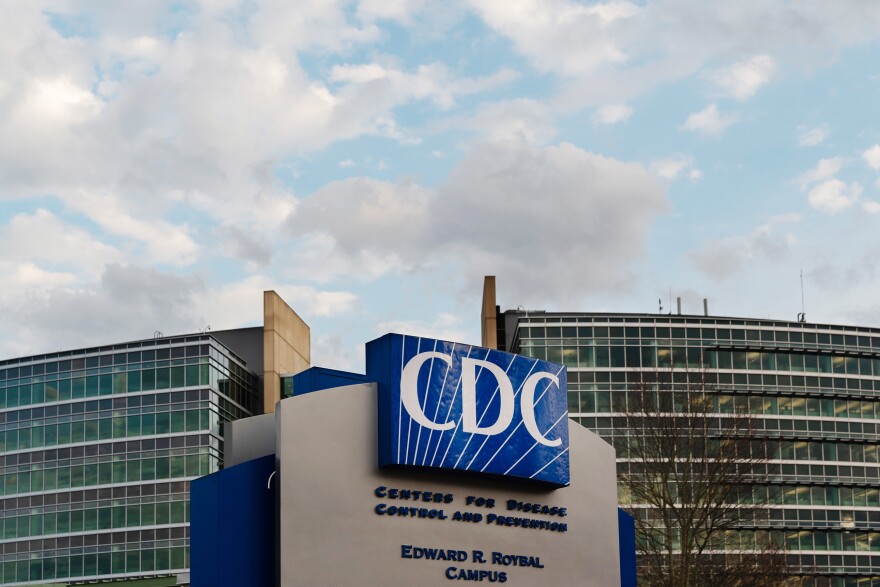 The Centers for Disease Control and Prevention (CDC) headquarters stands in Atlanta. CDC director Dr. Robert Redfield says the agency will double the current number of positions to aid local health departments in quashing new outbreaks.